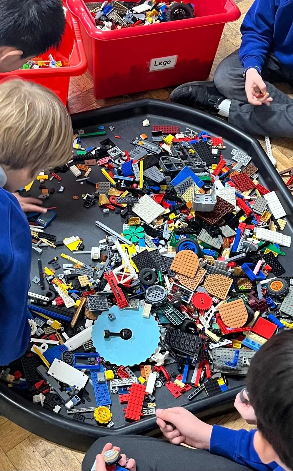 Children choosing and building with LEGO at Moss Hall Playcentre